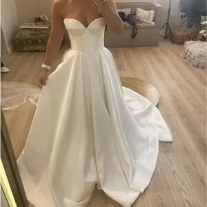 This beautiful dress has only been tried on, never worn.